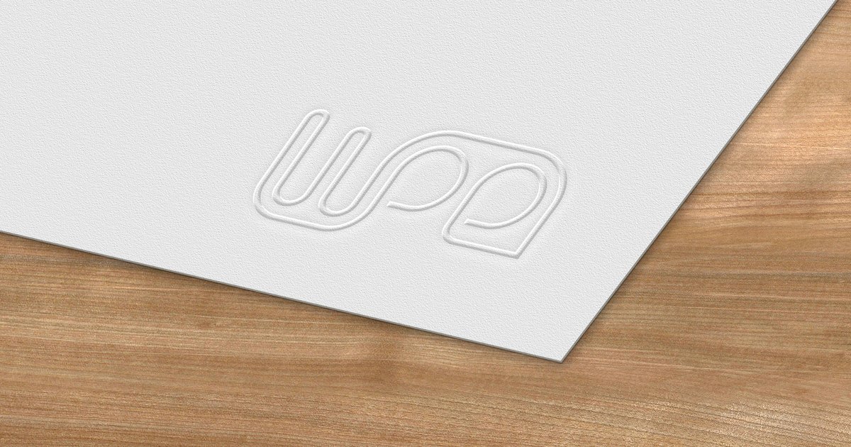 The WPE monogram blind-embossed into a sheet of white paper