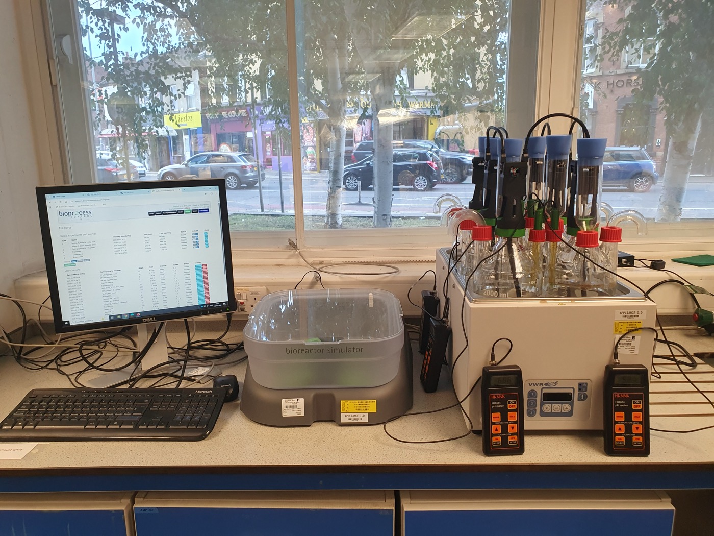 BioReactor Simulator III on a laboratory bench, with reactor vessels, probes and a monitoring computer